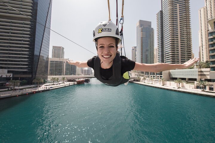 Soar high above the stunning Dubai Marina gliding over turquoise waters and modern skyscrapers. Experience the fun of zipping side by side with friends on this iconic urban adventure.